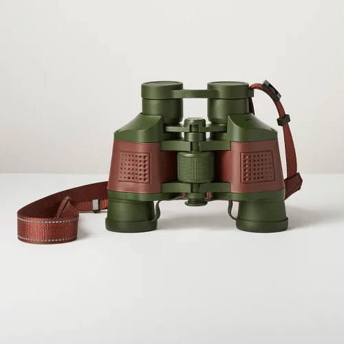 Green and brown binoculars with a strap, positioned on a plain background, ideal for outdoor activities like birdwatching or hiking.
